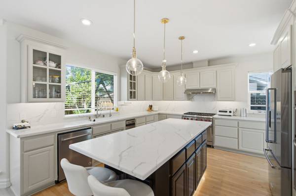 Modern kitchen with large island and high-end appliances in Cambrian San Jose home