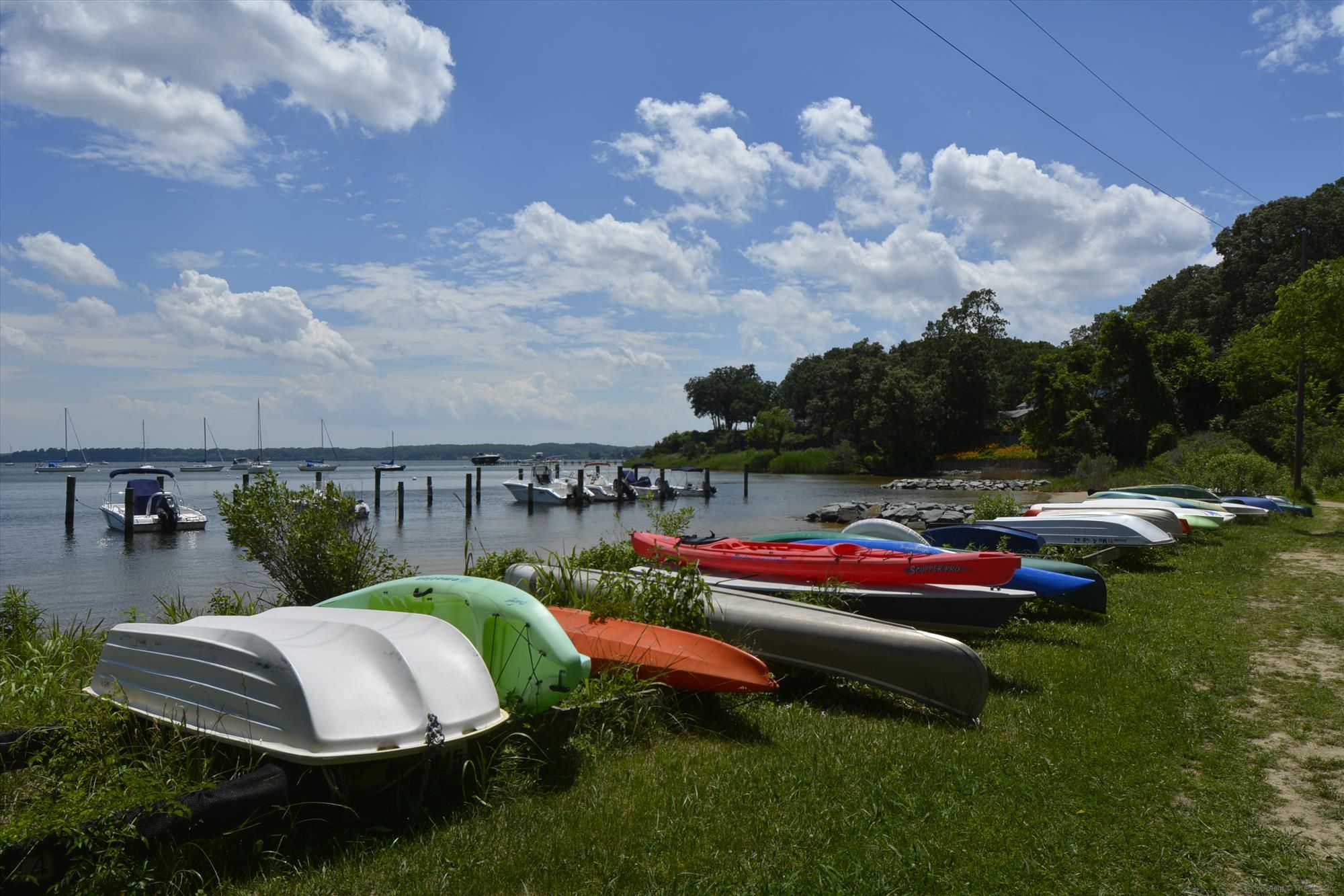 Kayaks and small boats beside the water in the Annapolis area