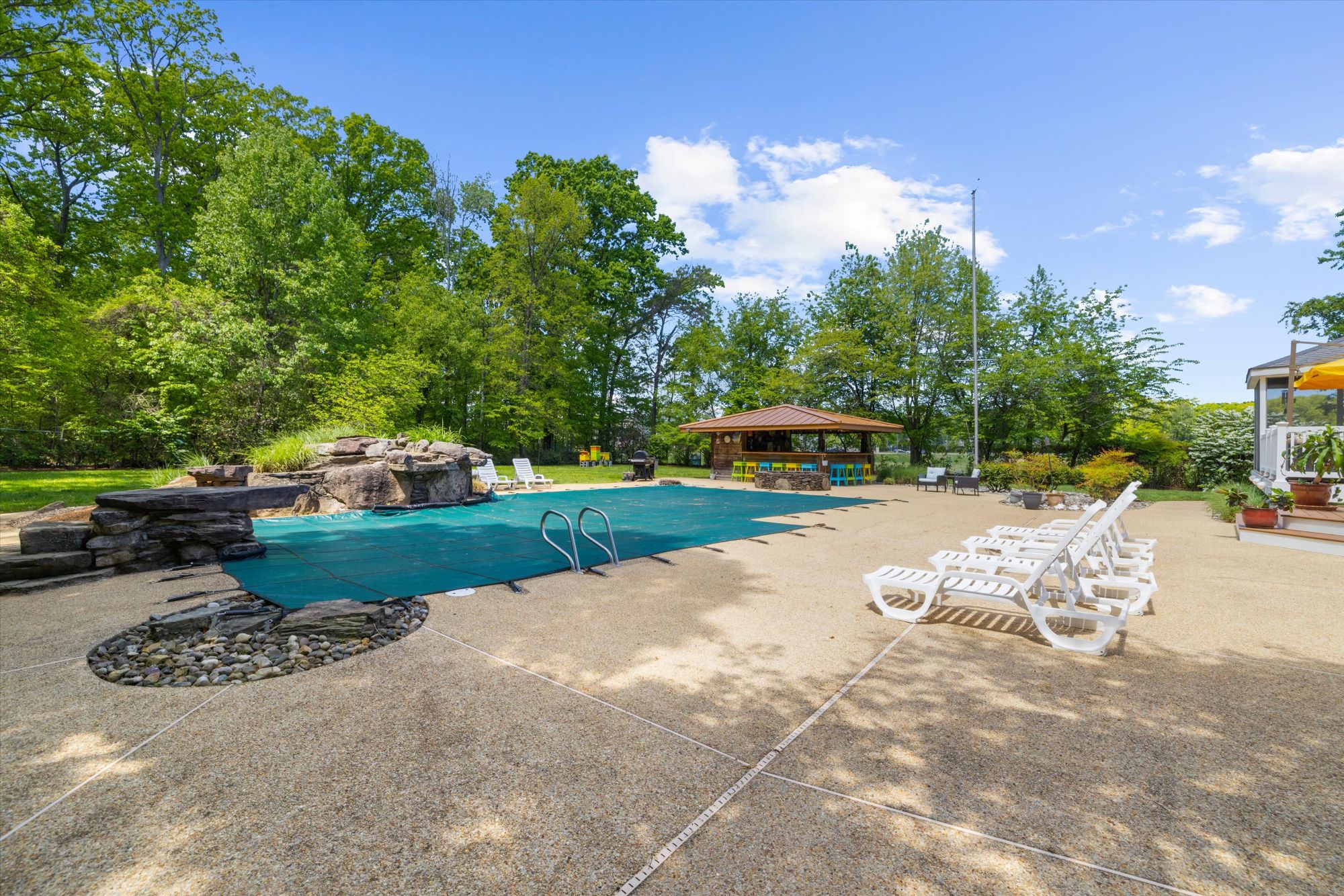 Pool house and outdoor living space at 470 Jumpers Hole Road