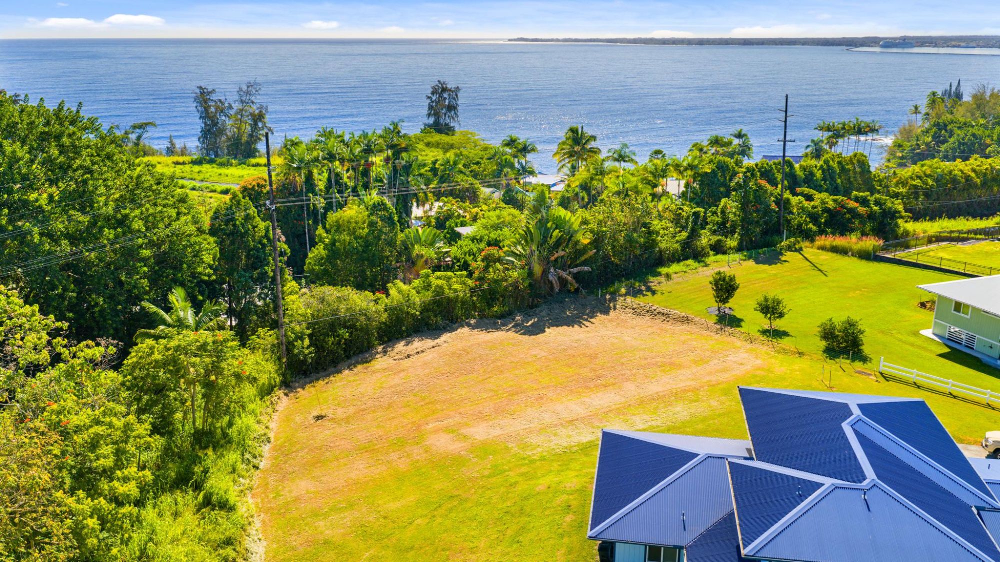 Building site showing flag-lot access and cleared terrain.