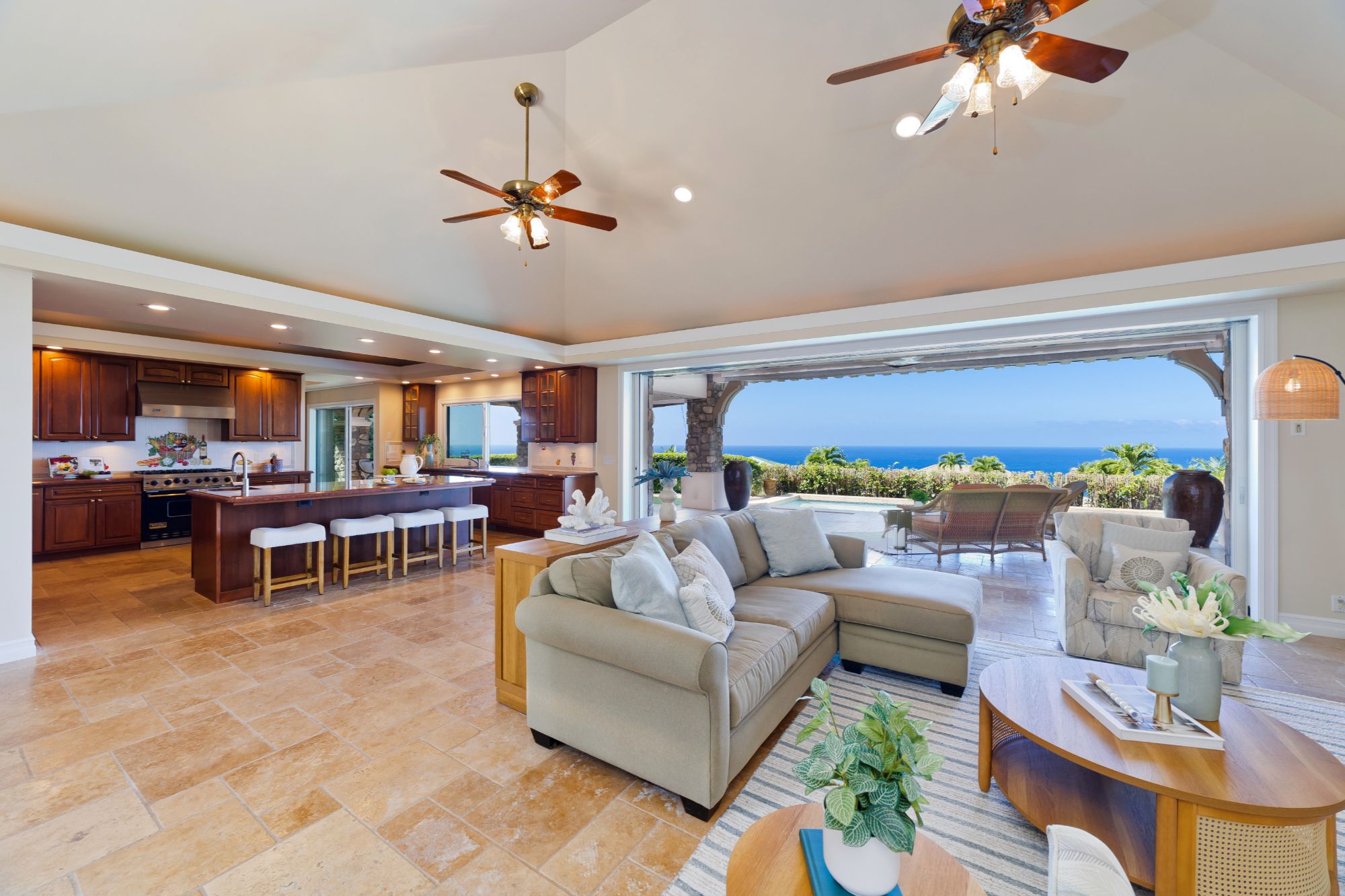 Open-concept kitchen and great room showcasing ocean and sunset views from this Bayview Estates home.