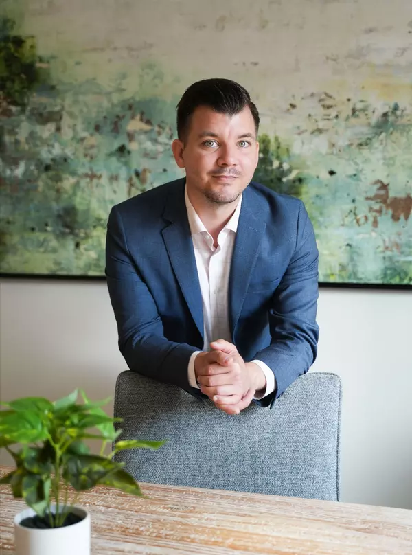 Which real estate agencies specialize in The Woodlands properties?