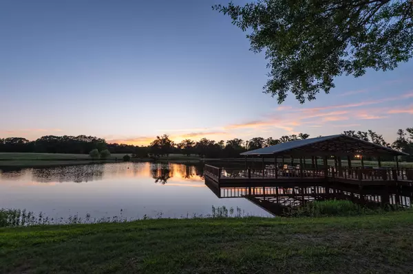 Sunset on Woodland Ranch with Private Lake and Covered Boat Dock Quitman TX Ranch for Sale Wood County ground