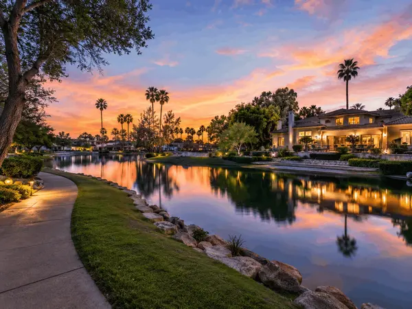 Scottsdale Ranch lakefront home and walking path at sunset in Scottsdale, Arizona