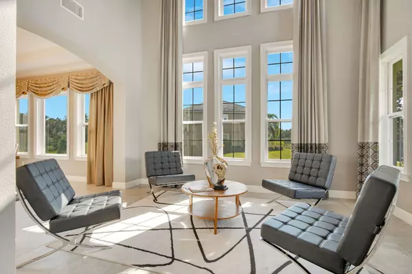 Entertain in style! The formal living room offers an inviting space with ample natural light, perfect for gatherings and relaxation.