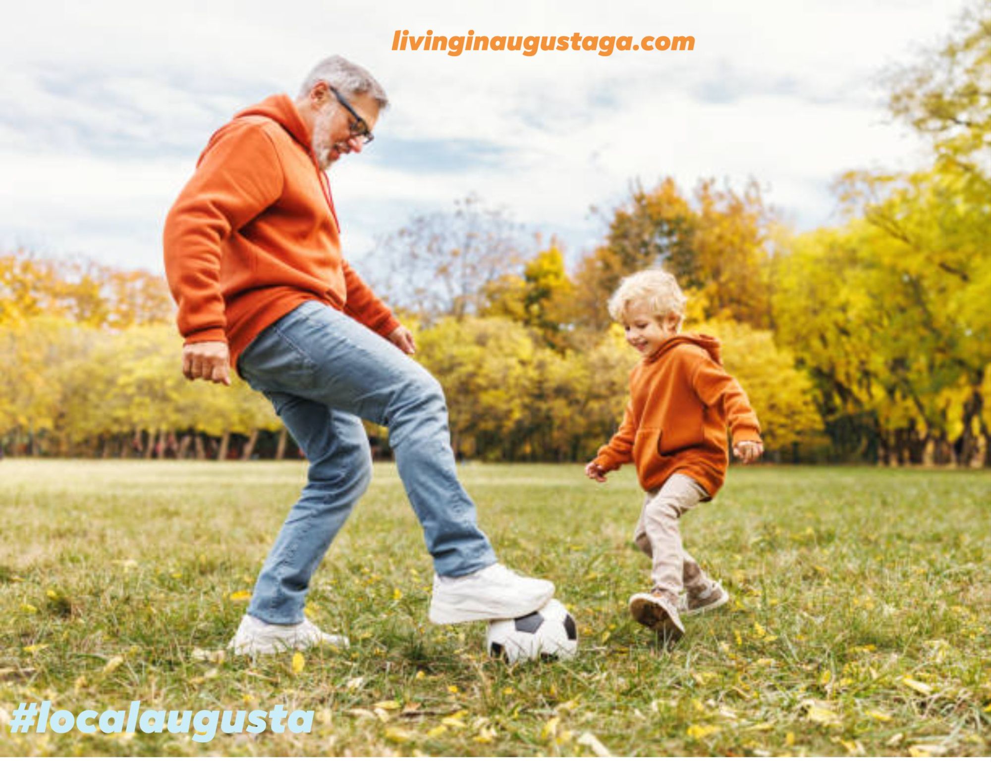 Grandfather playing soccer with his grandson in a neighborhood park in Augusta, Georgia.