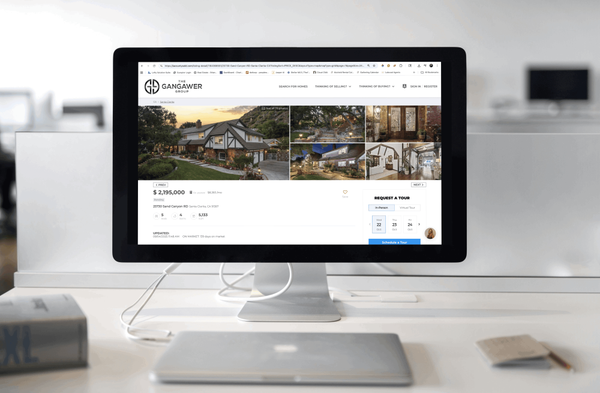 Residential home for sale displayed on computer.