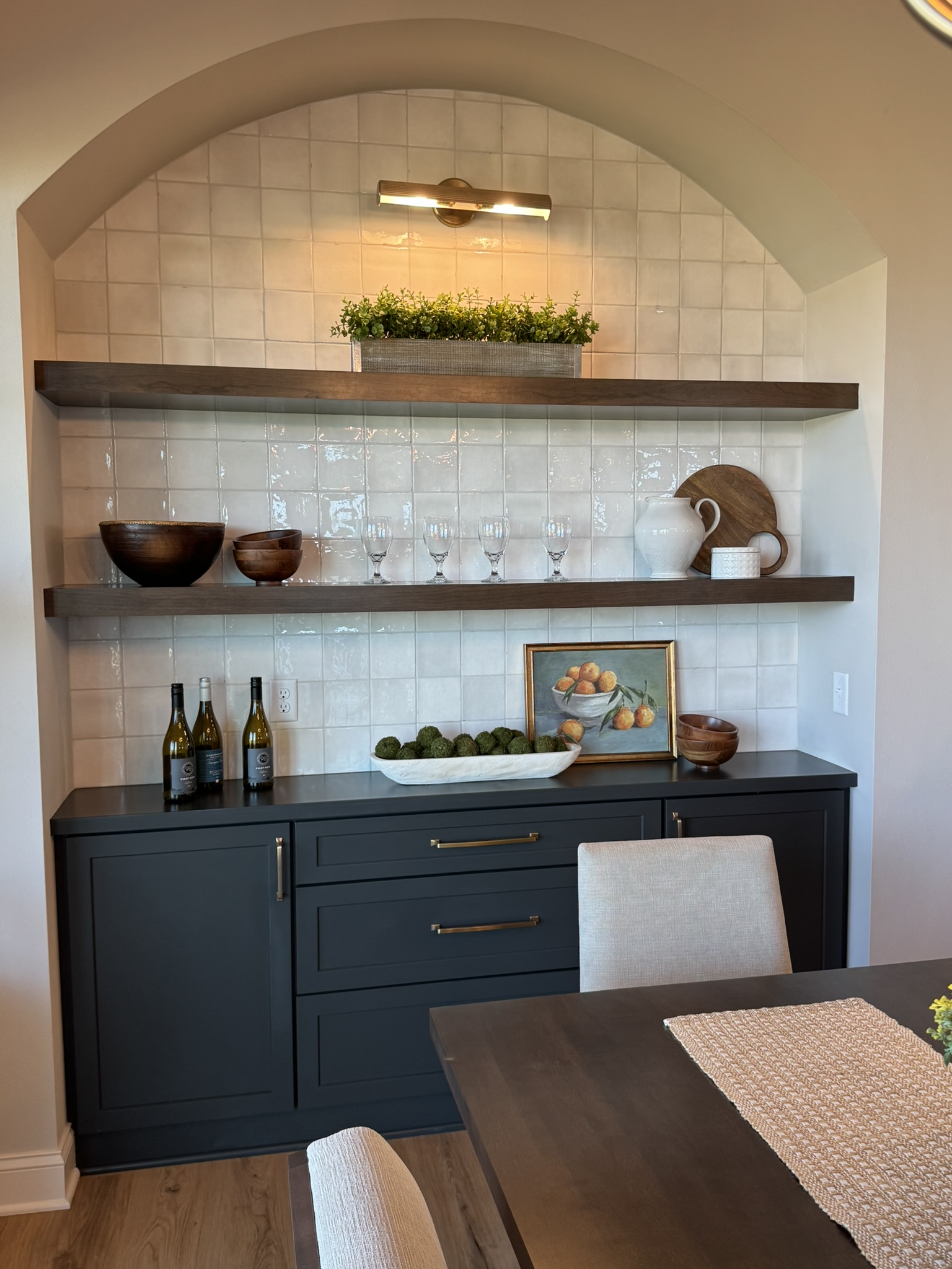 Built-in dining buffet with floating shelves in a recent Waunakee Parade home