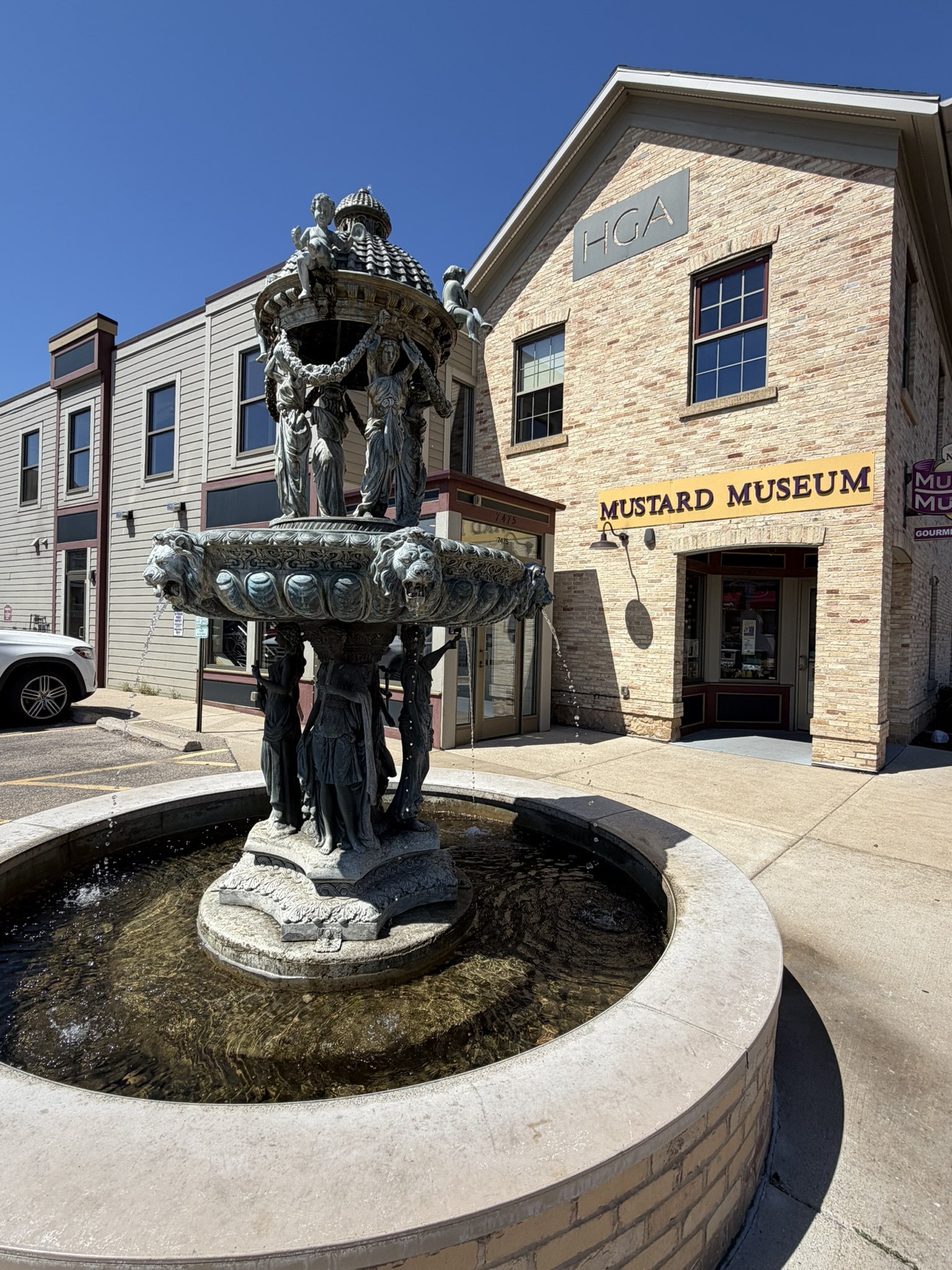 Historic fountain in downtown Middleton, Wisconsin with the National Mustard Museum in the background.
