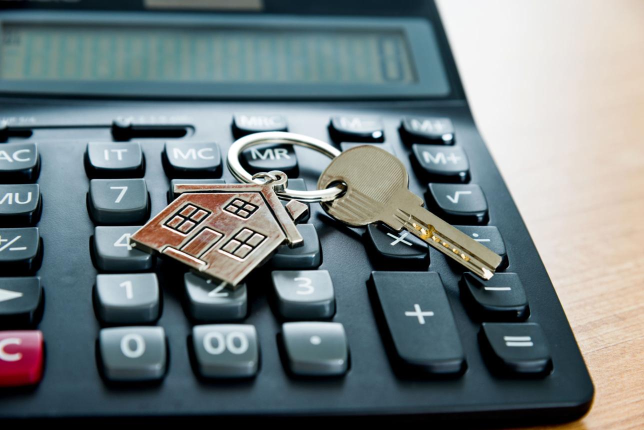 Buyers signing closing documents on a new home