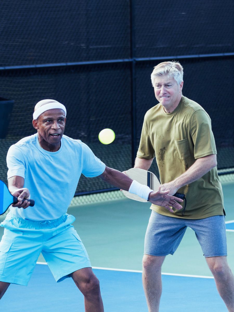 Choosing the Right Manufactured Home Community with two men playing pickleball