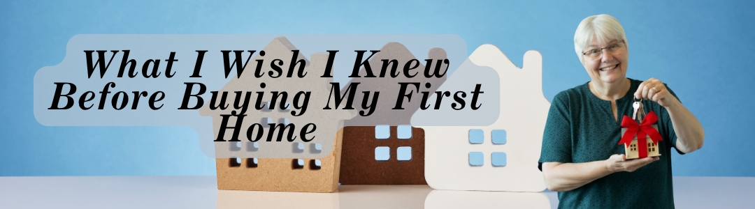 Woman holding house keys and a tiny toy house