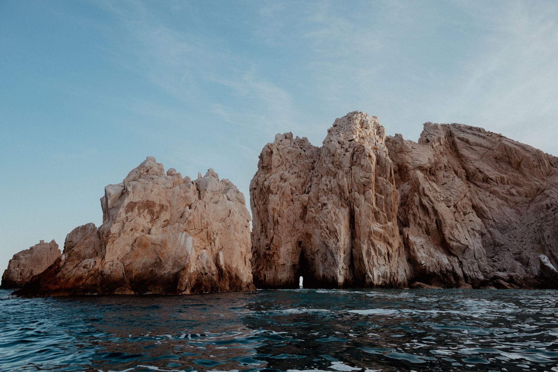 El Arco rock formation in Cabo San Lucas, Mexico, surrounded by blue water