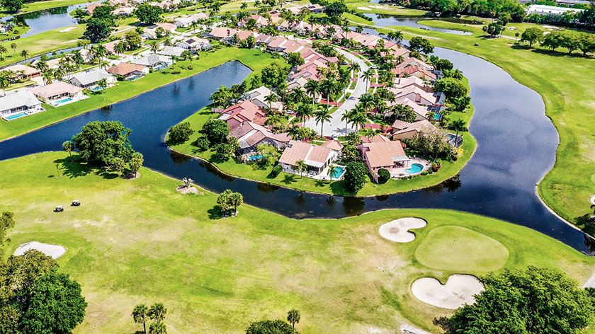 Aerial view of a gated golf community with homes for sale in Davenport, Central Florida