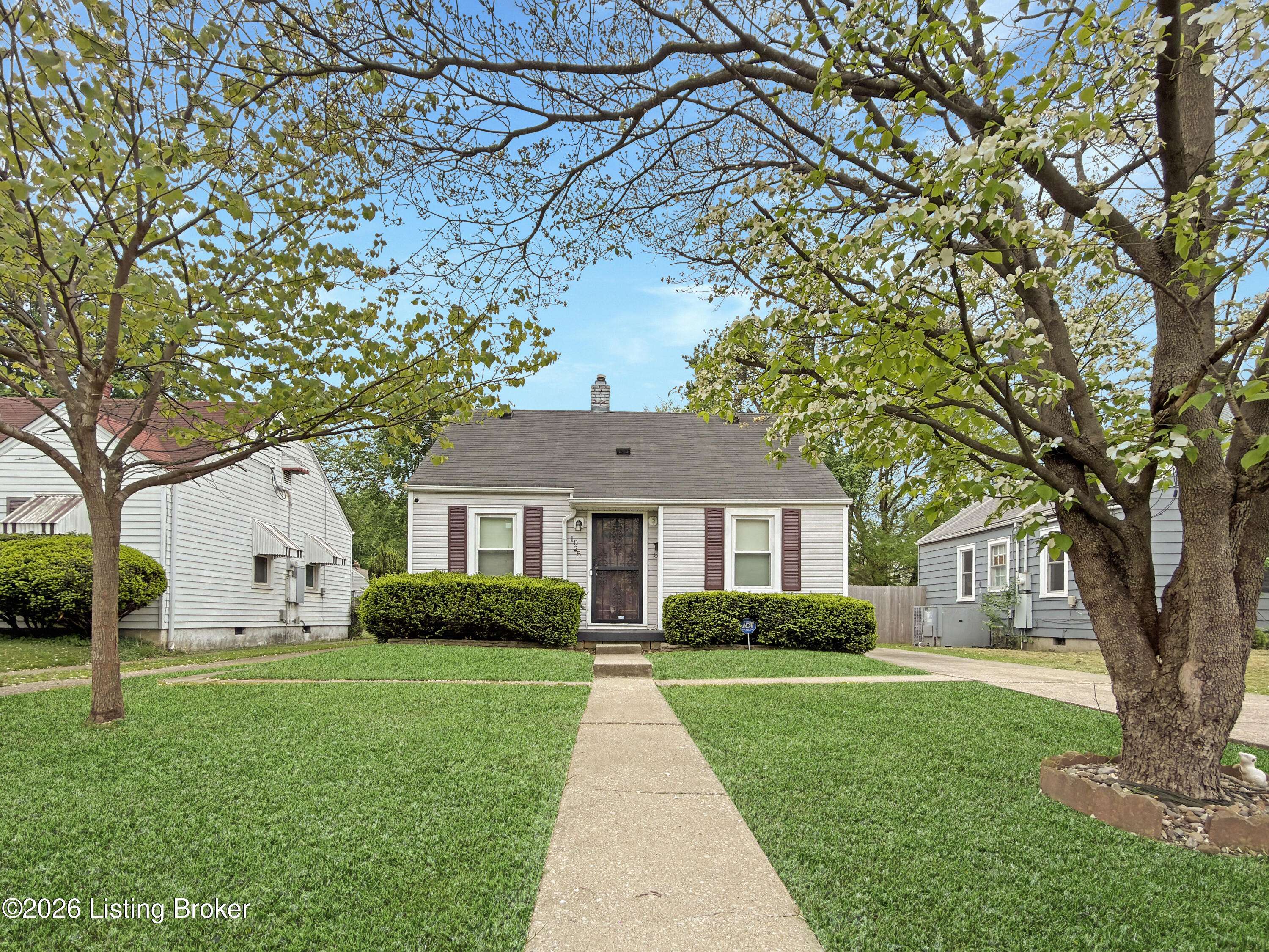 Front exterior of investment home on Berry Blvd Louisville KY