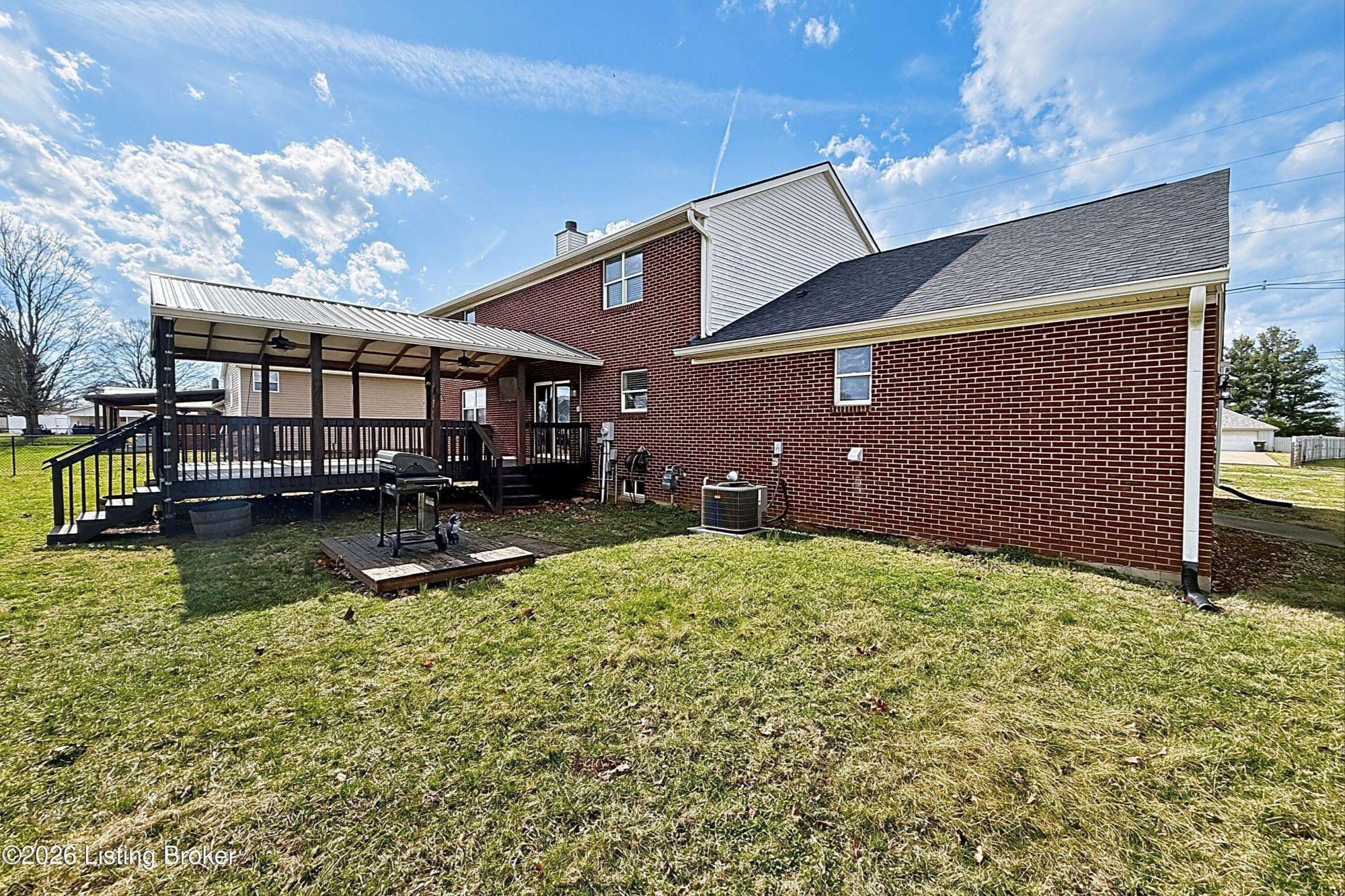 Backyard with usable space in Bullitt County property