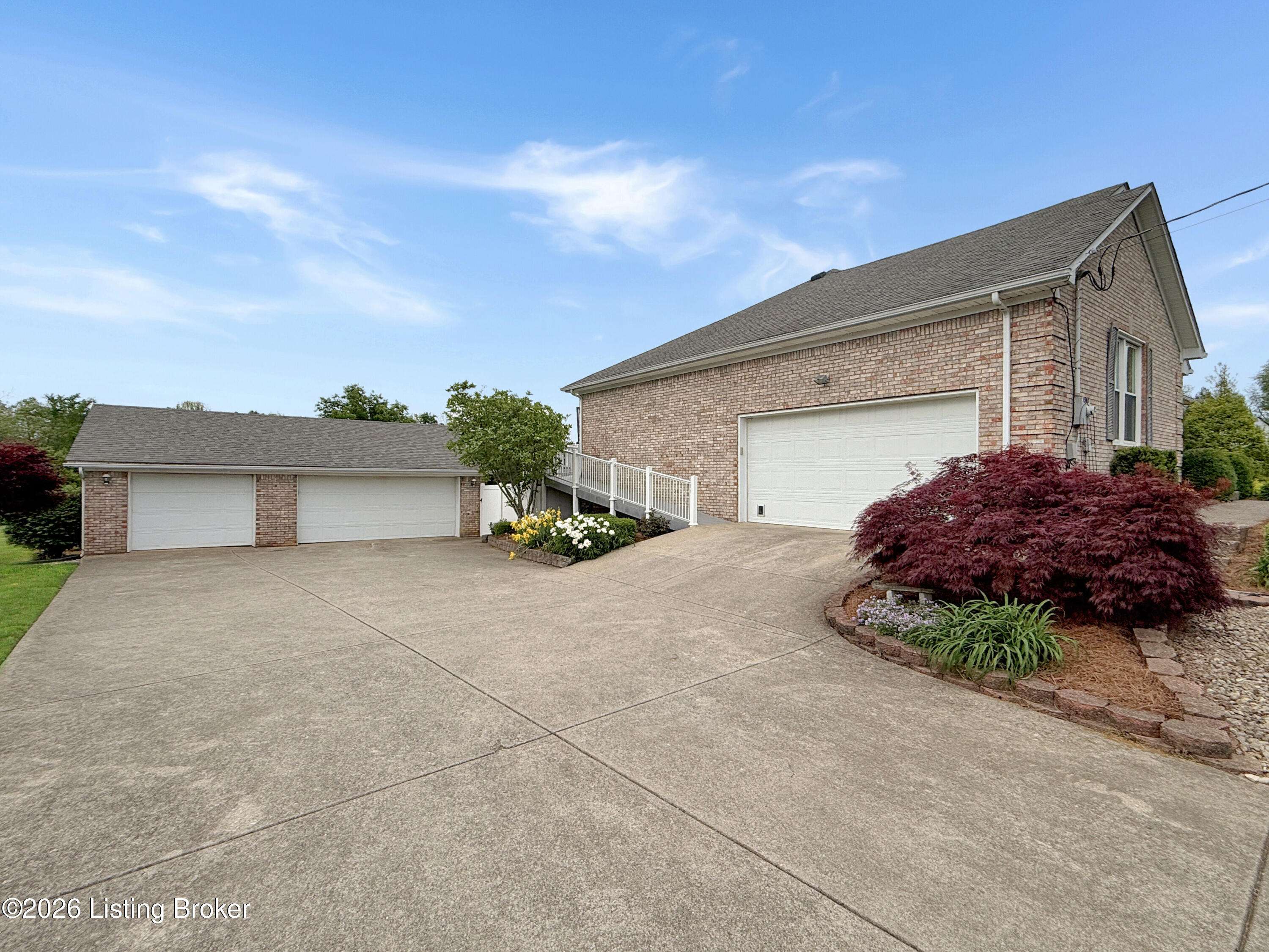 Front exterior of home in Taylorsville KY with attached garage