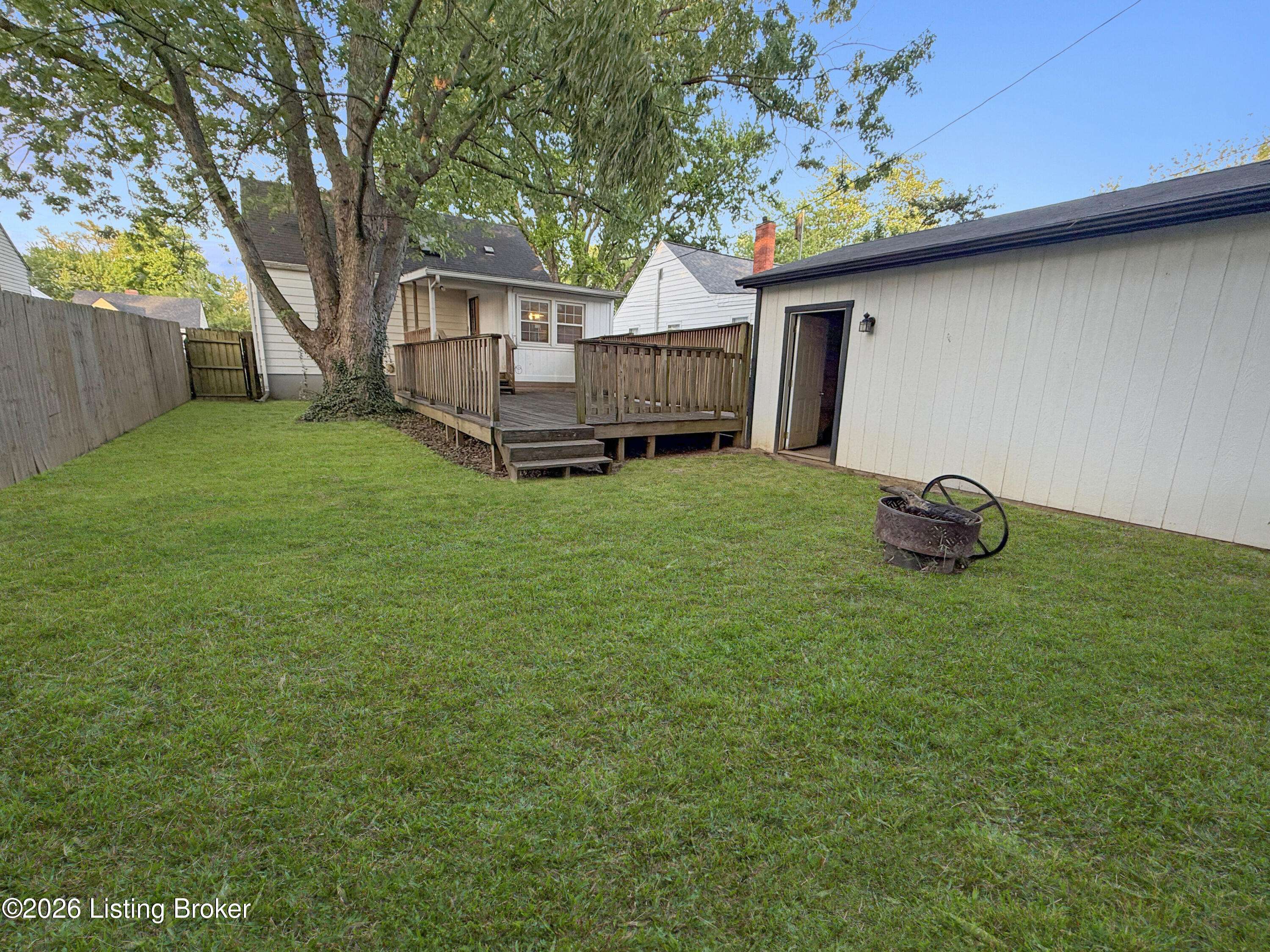 Backyard space with yard in Louisville KY property