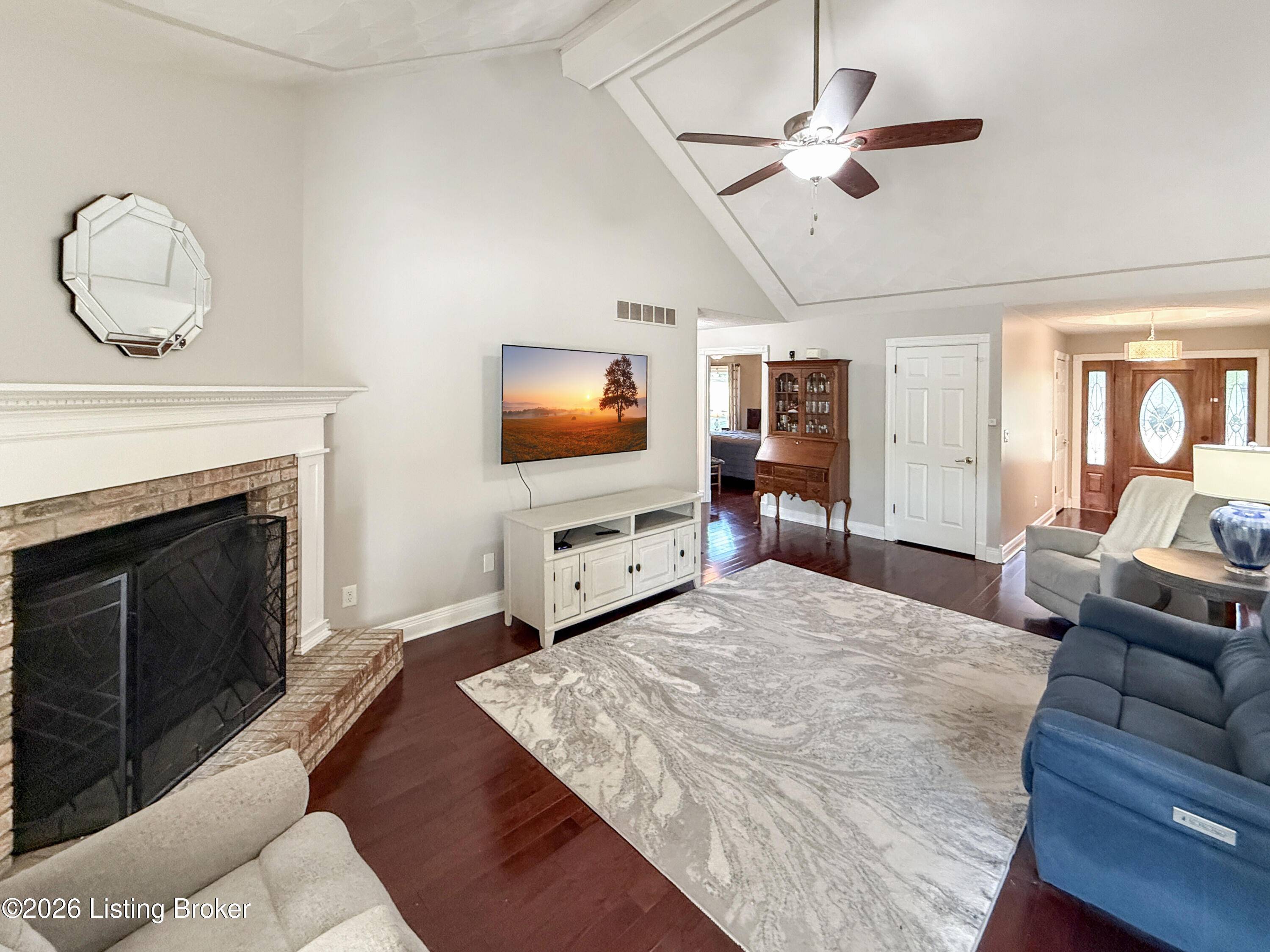 Open concept living room with natural light in Taylorsville home