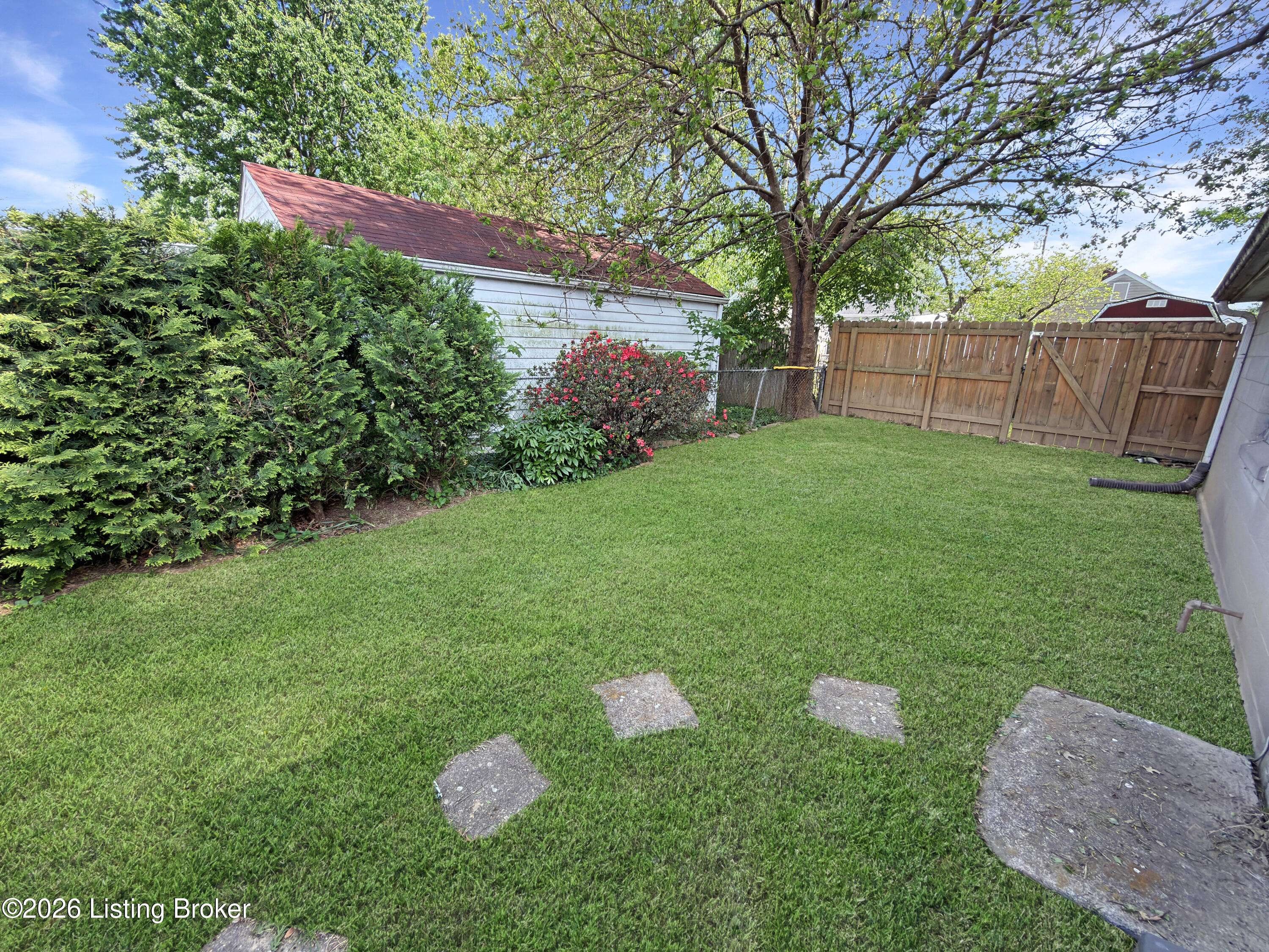 Backyard area with yard space in Louisville property
