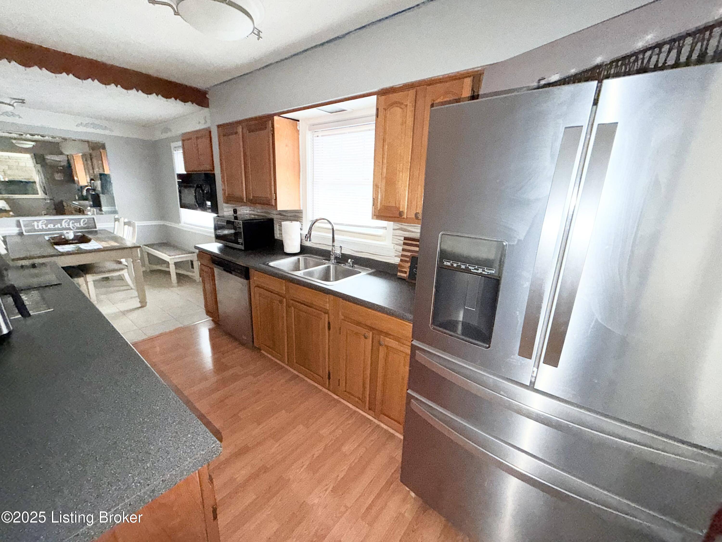Kitchen and dining area with natural light KY home