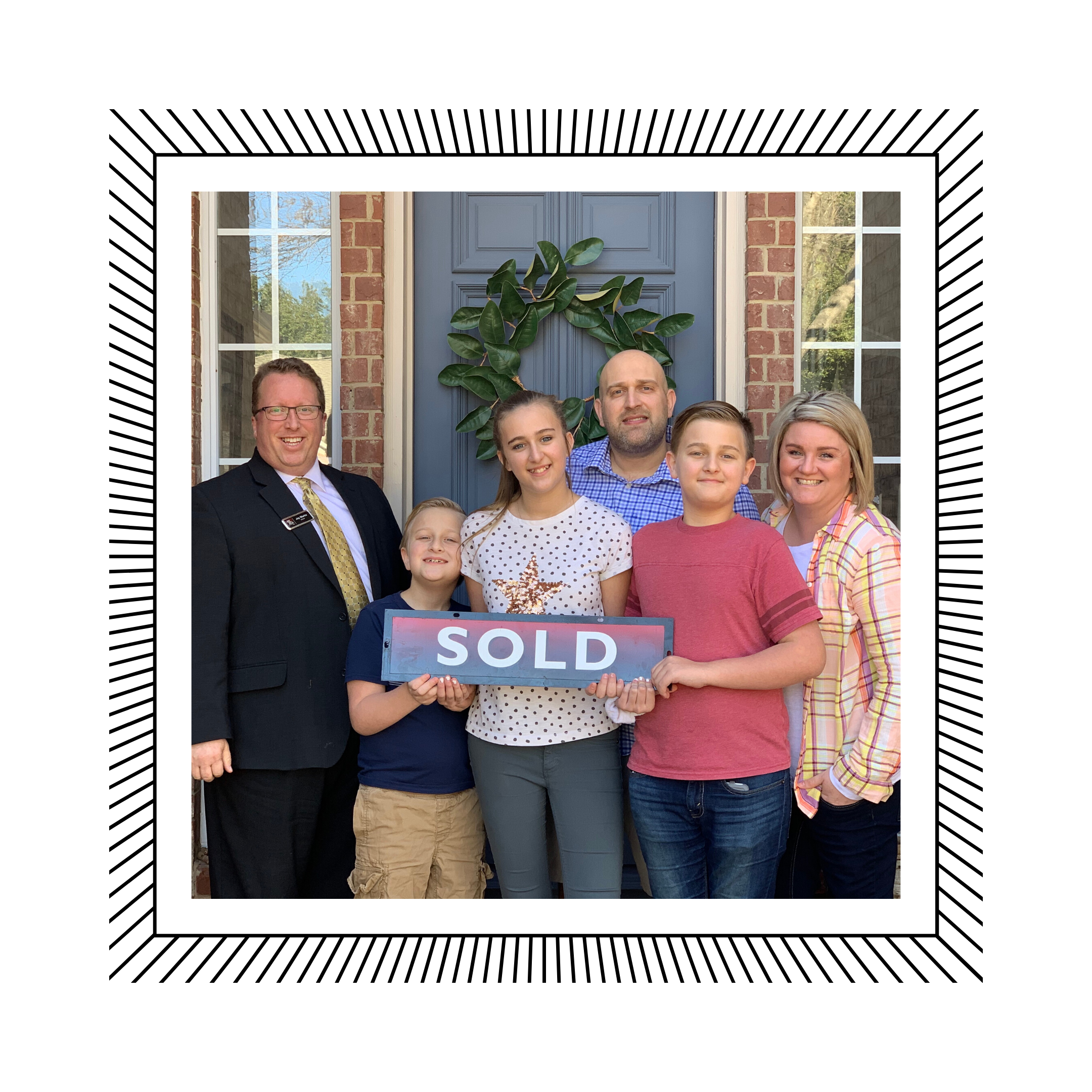 Happy family with Sold sign