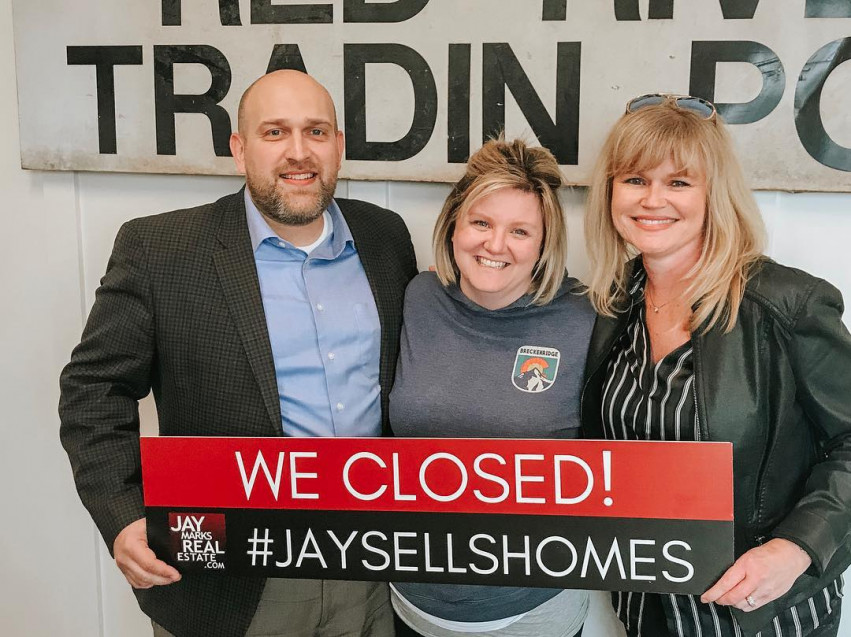 Clients celebrating their home closing with Jay Marks