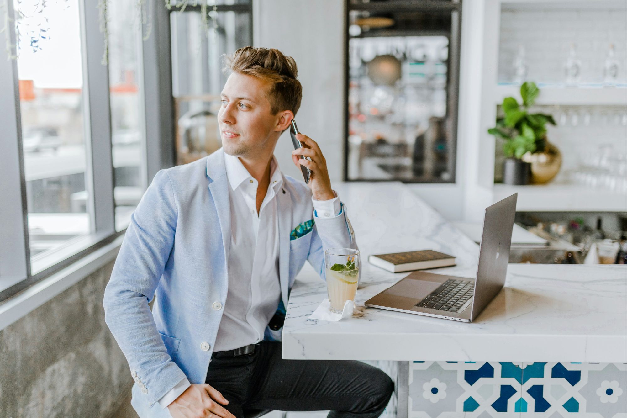 Real estate agent on the phone, looking at the window