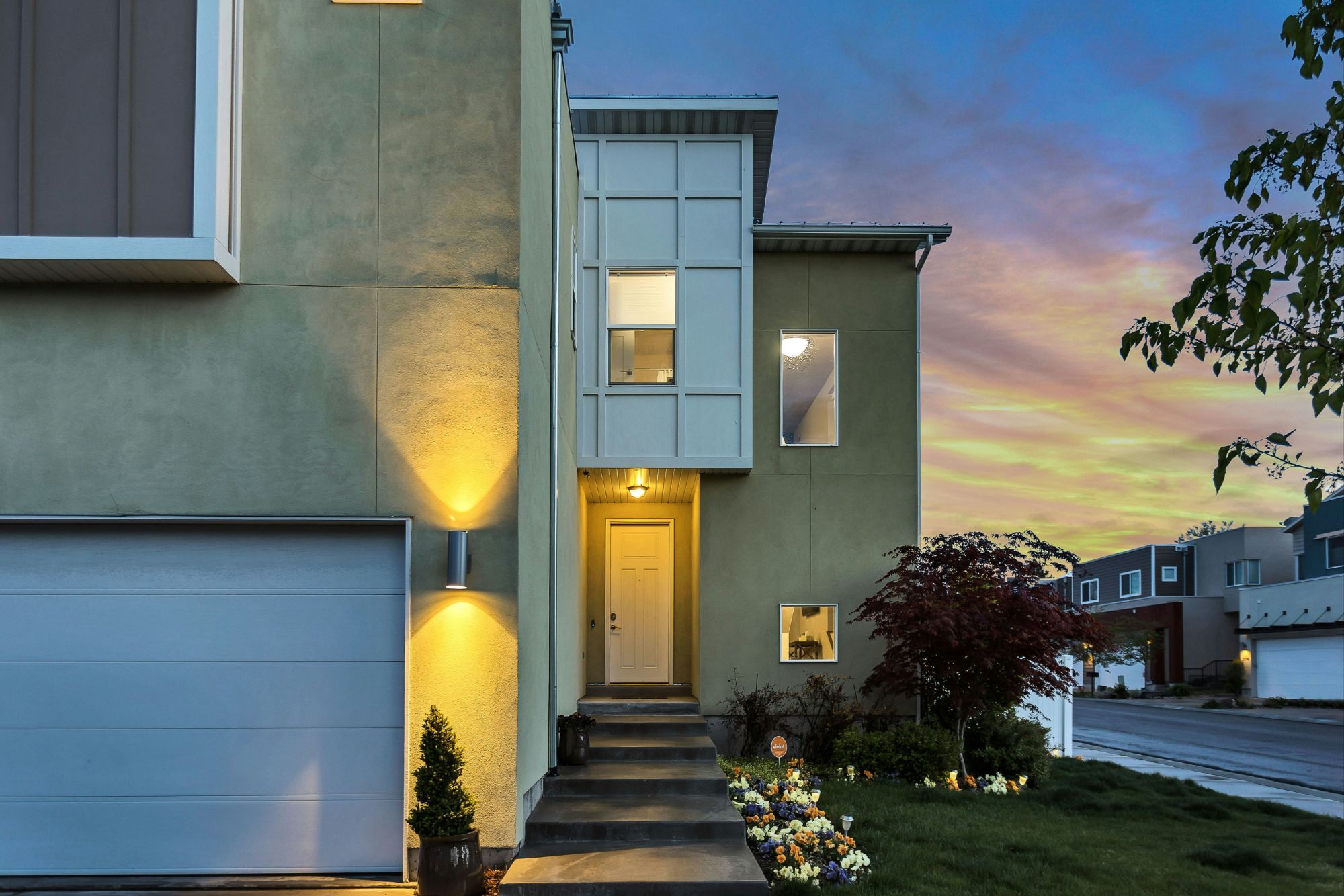  A modern home in a neighborhood at sunset
