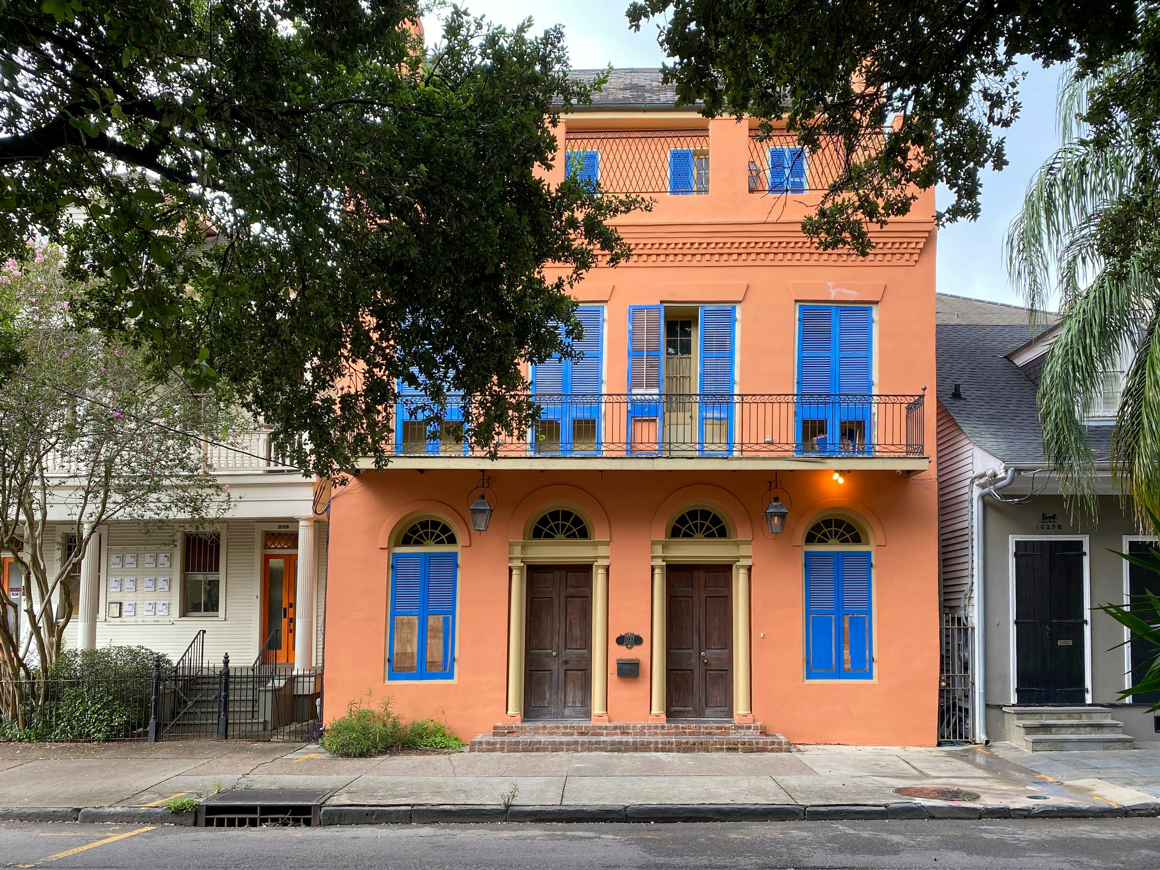 An orange house with blue shutters in Louisiana