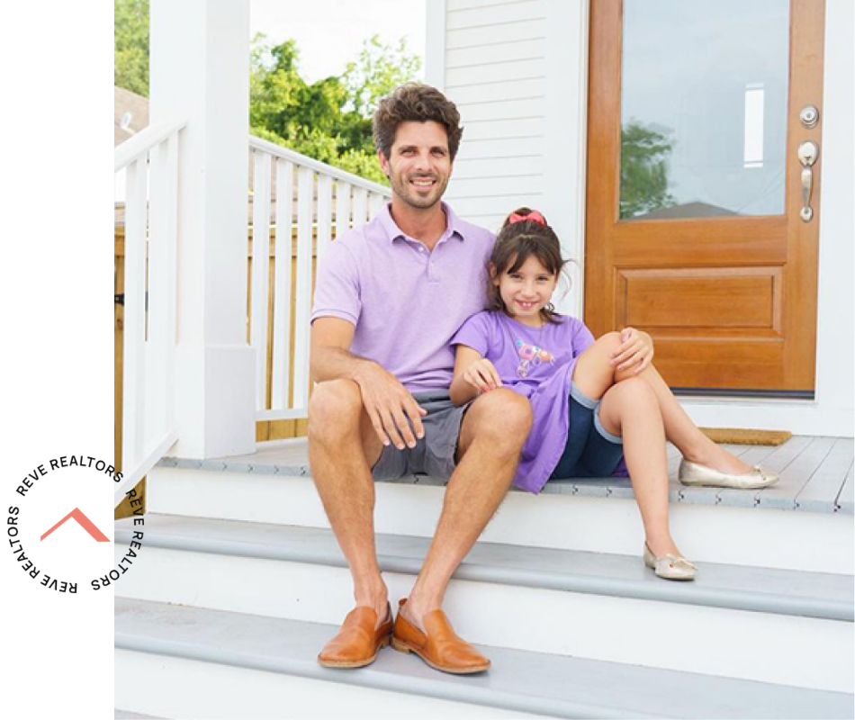 Father and daughter sitting on front steps of their new home — Rêve Realtors