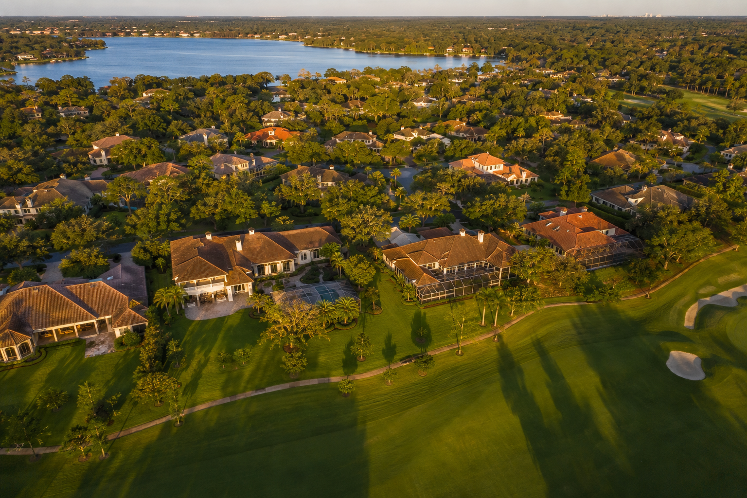 Residential street in Phillips Landing subdivision Dr. Phillips Orlando showing lake views and mature landscaping