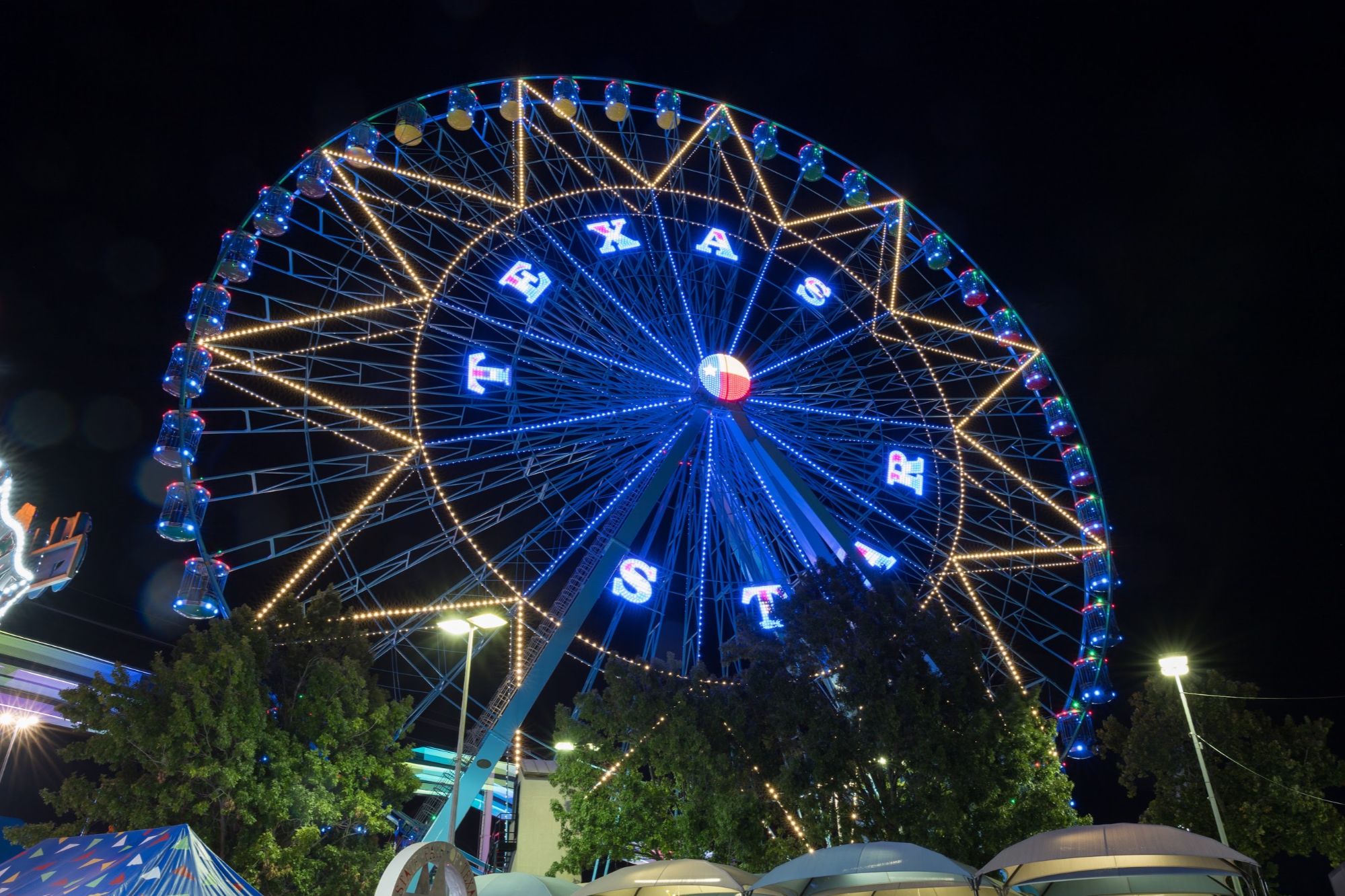 The Texas Star lights up the Midway at night. Photo Credit: State Fair of Texas