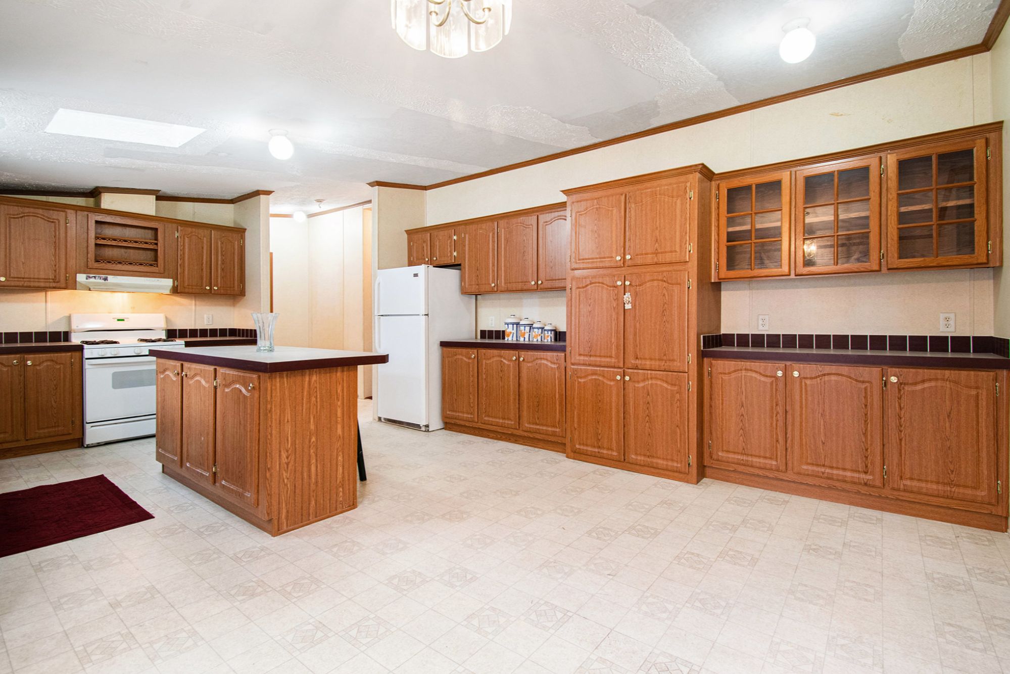 Kitchen inside ranch home at 574 E 1100 N in Westville Indiana featuring ample cabinetry and open layout in Jackson Township Porter County