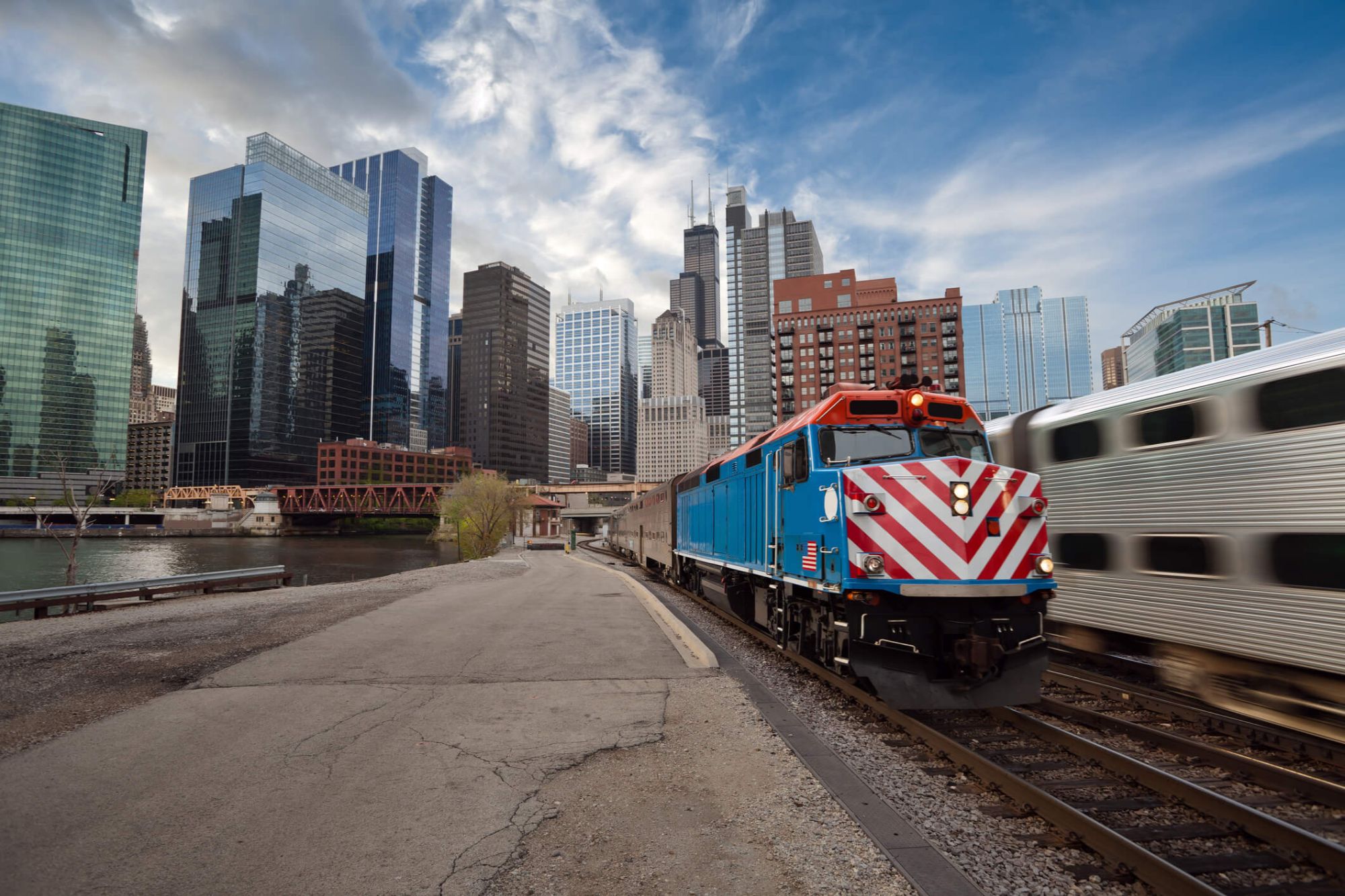 Chicago skyline and commuter train for buyers moving to Northwest Indiana