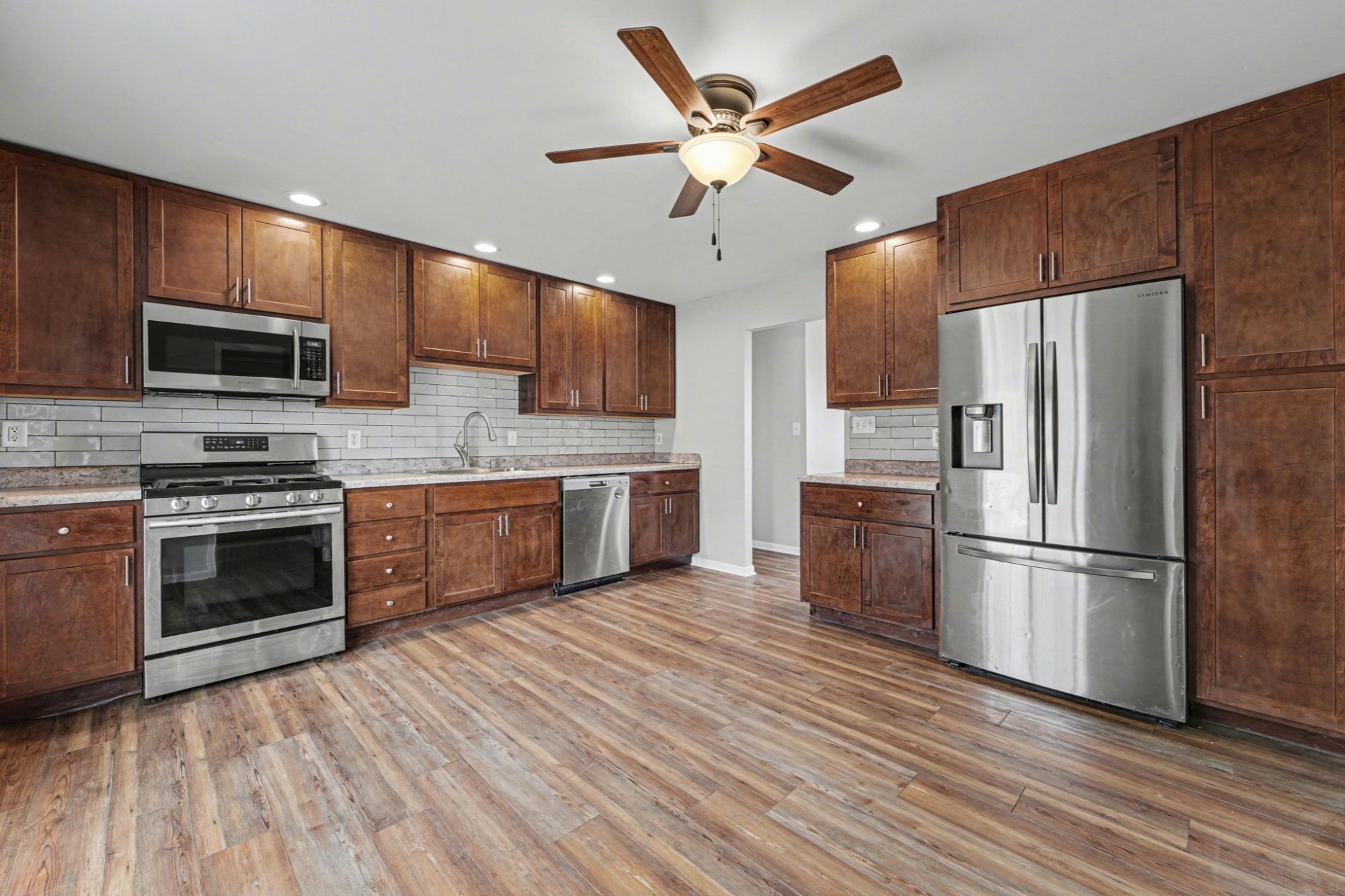 Valparaiso IN ranch home with heated garage, large yard, deck, pool and peaceful farm field views