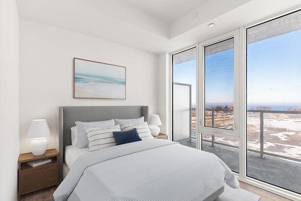 virtually staged Second bedroom with large closet and window at 220 Missinnihe Way Port Credit