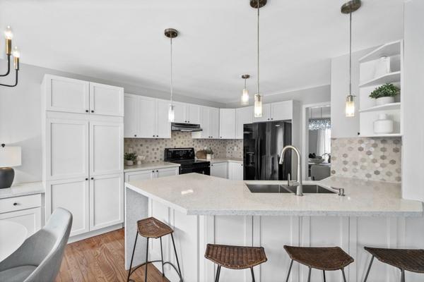 kitchen with quartz countertops and hexagon tile backsplash and pantry at 1537 Morse Place Beaty Milton