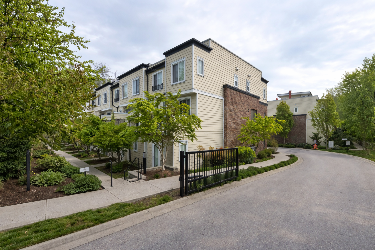 Entrance to The Woods townhomes at South Surrey featuring landscaped grounds and residential buildings in Grandview neighbourhood
