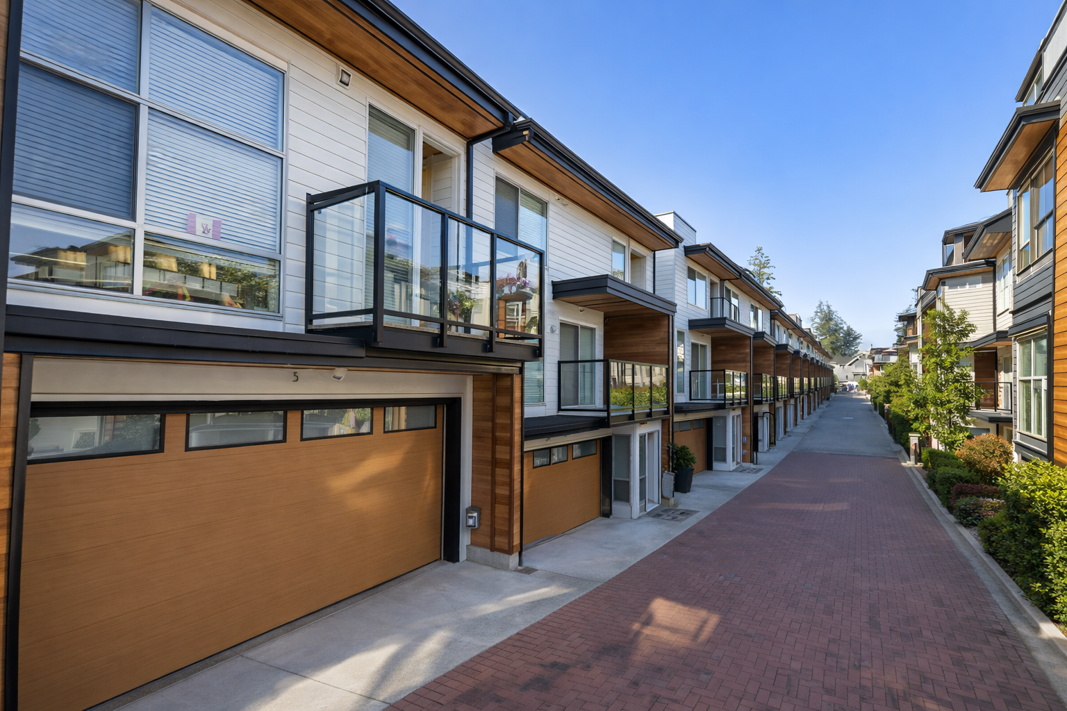 Modern Greenway townhomes driveway view at 2825 159 Street South Surrey showing contemporary exterior design and garages