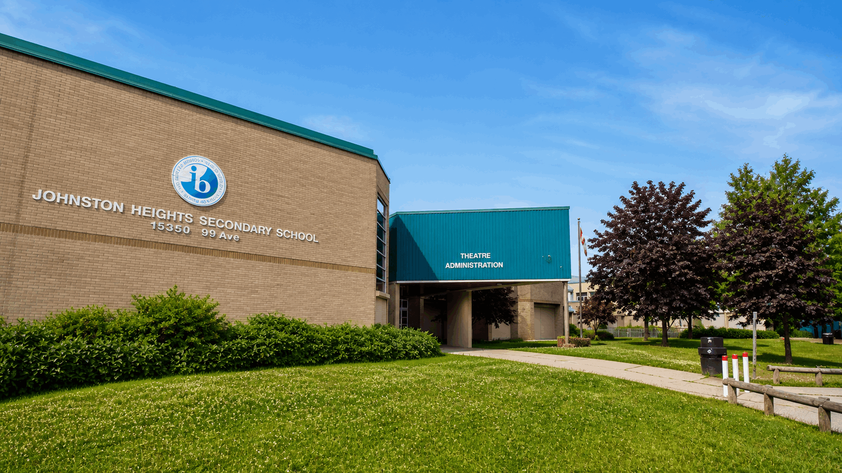 Johnston Heights Secondary School in Surrey BC exterior view showing school building, entrance and surrounding grounds