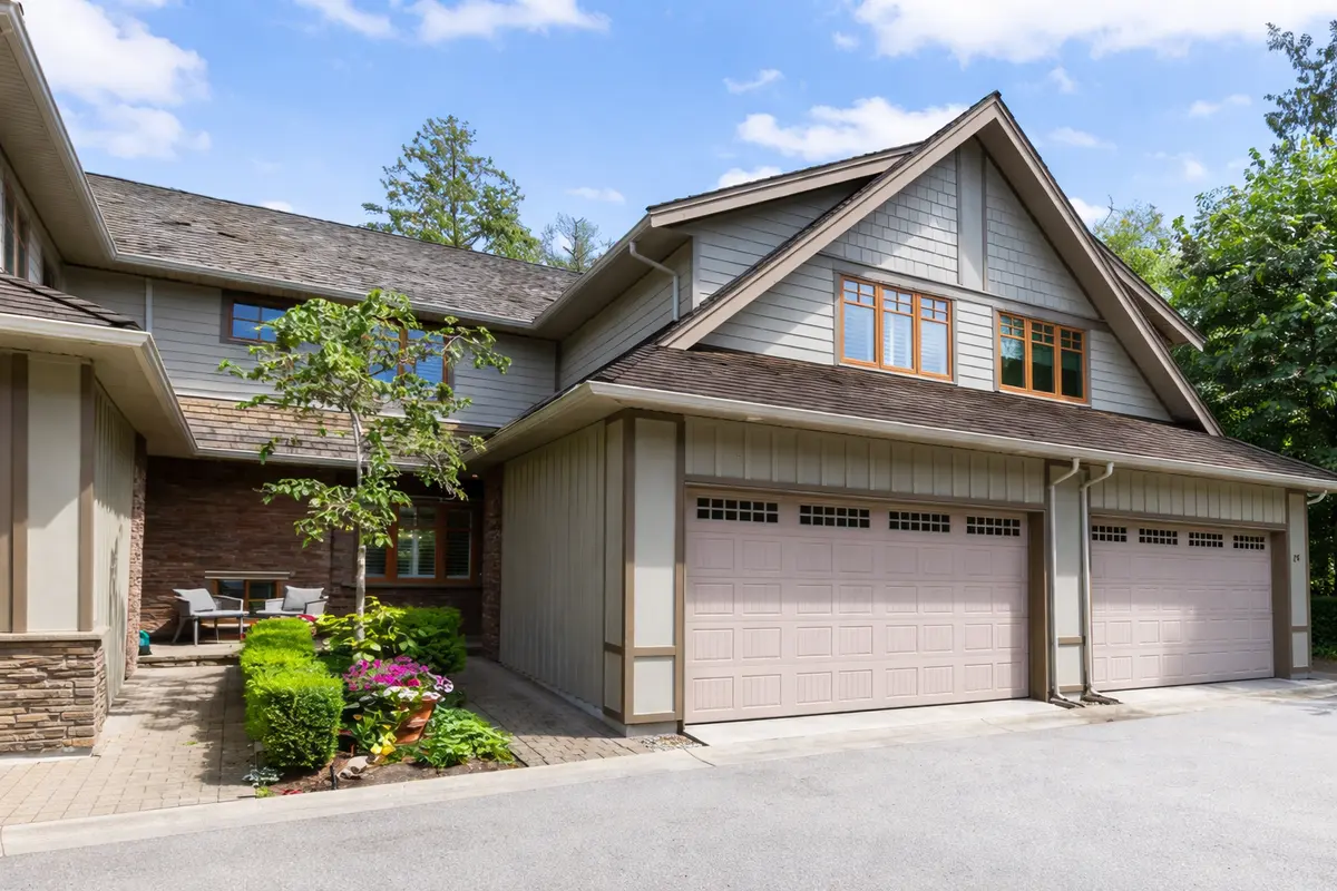Exterior view of Wills Creek townhomes in South Surrey showing garages, landscaped entry, and residential architecture in Grandview neighbourhood