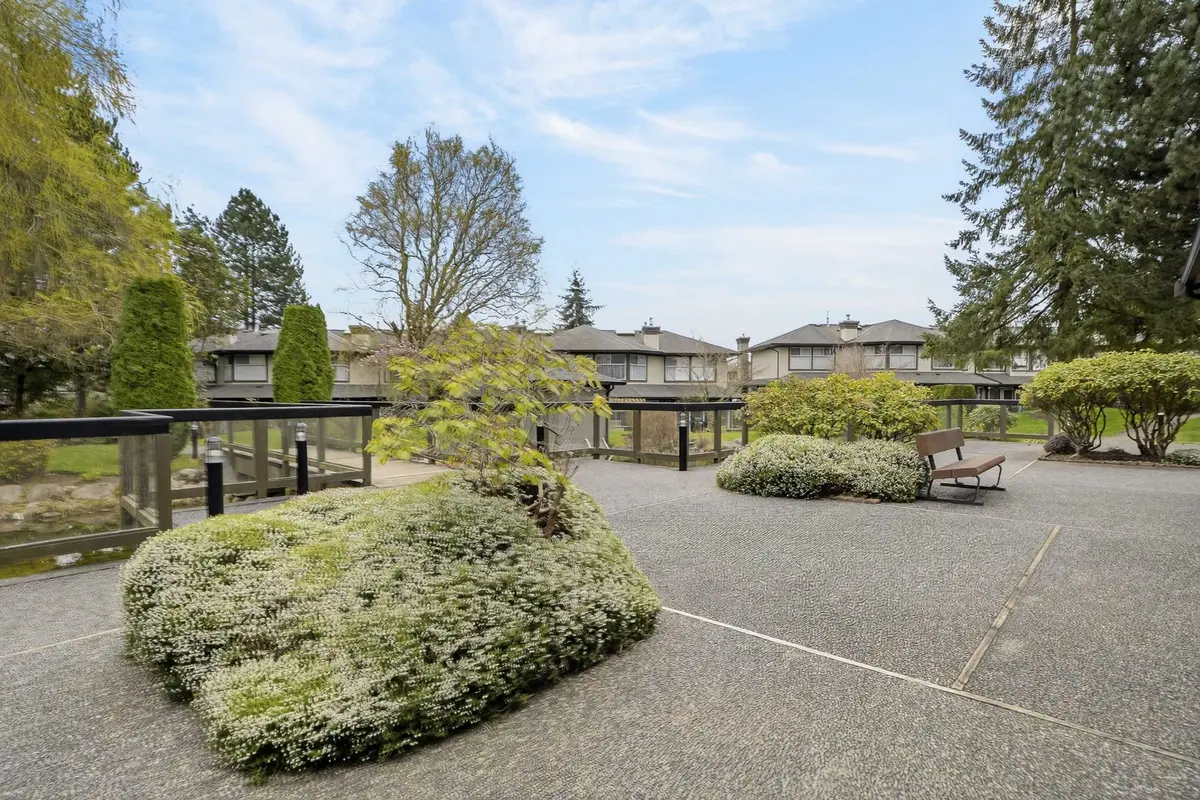 Shared outdoor space at Ponderosa Estates townhomes 16080 82 Avenue Fleetwood Surrey showing landscaped common area and residential complex