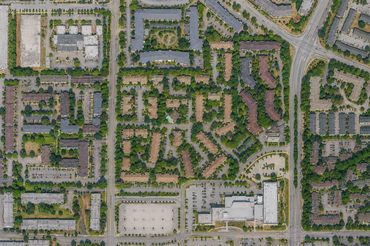Aerial map of Lincoln's Gate townhomes at 10620 150 Street in Guildford, Surrey BC, highlighting the townhouse community, surrounding residential neighbourhood, Guildford Recreation Centre, nearby roads, and green spaces without business names or map labels.