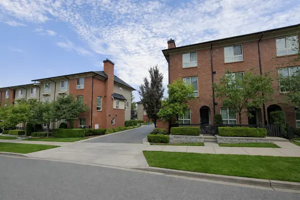 Greenway townhomes in South Surrey at 16261 23A Ave featuring classic brick architecture, landscaped streets, and a prime Grandview Heights location close to shopping, schools, and parks.