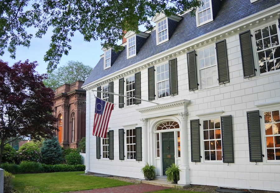 Classic New England home exterior with dark shutters