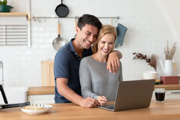 handsome-man-embracing-his-wife-while-standing-mak-2025-01-09-01-24-37-utc