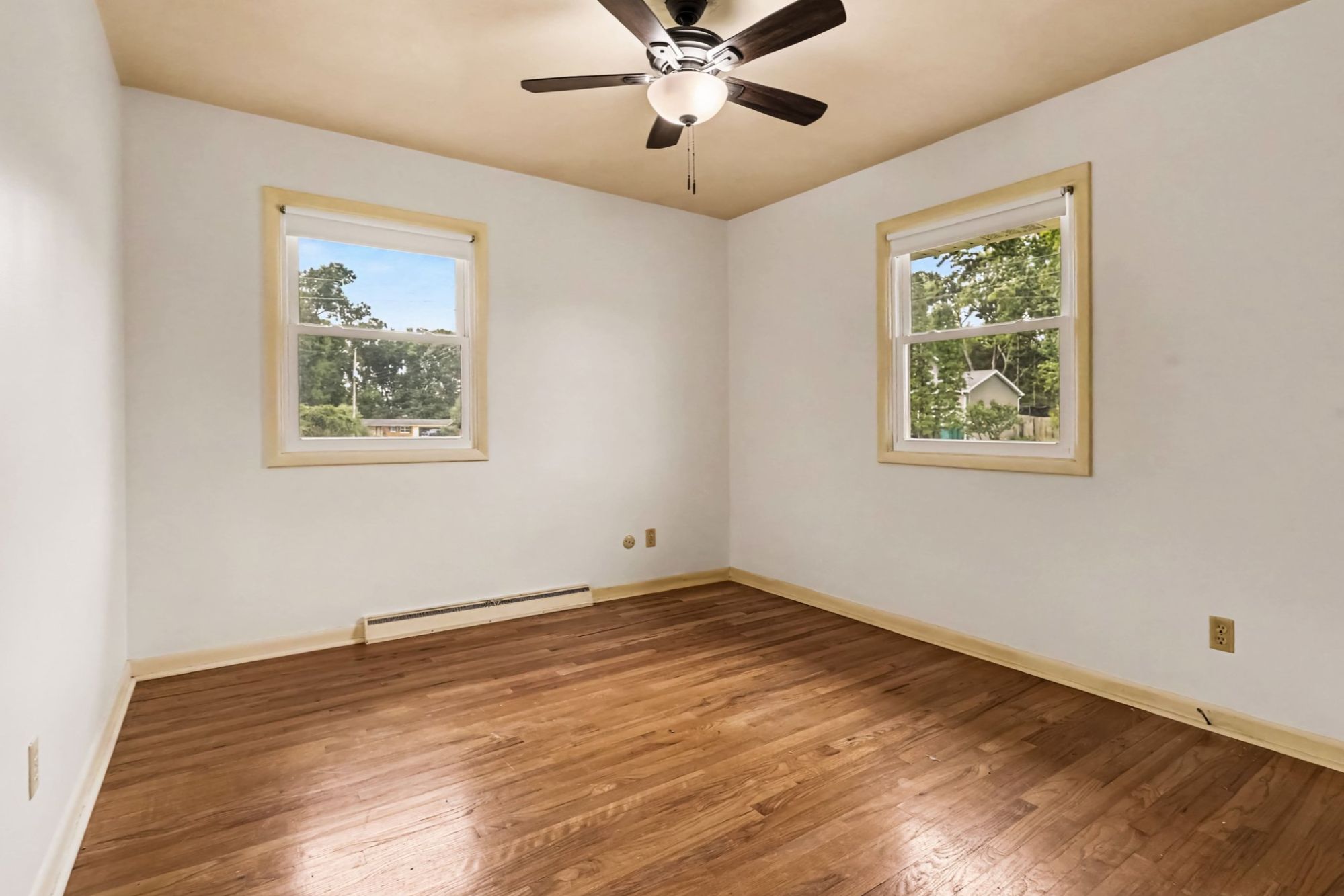 Bedroom with hardwood flooring
