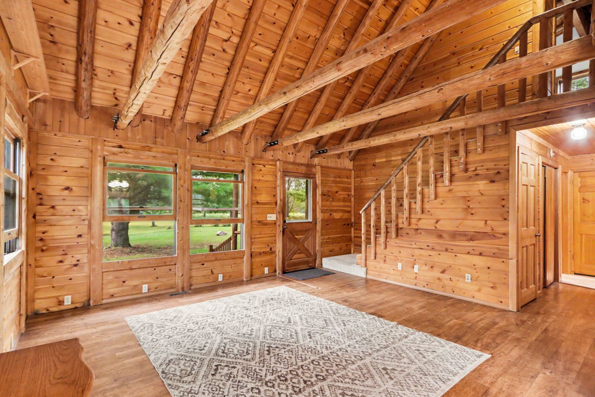 Vaulted log home interior at 13228 S 5th Street Schoolcraft Michigan