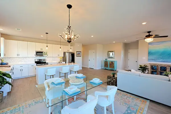 Dinning room and chef’s island view into kitchen and living room